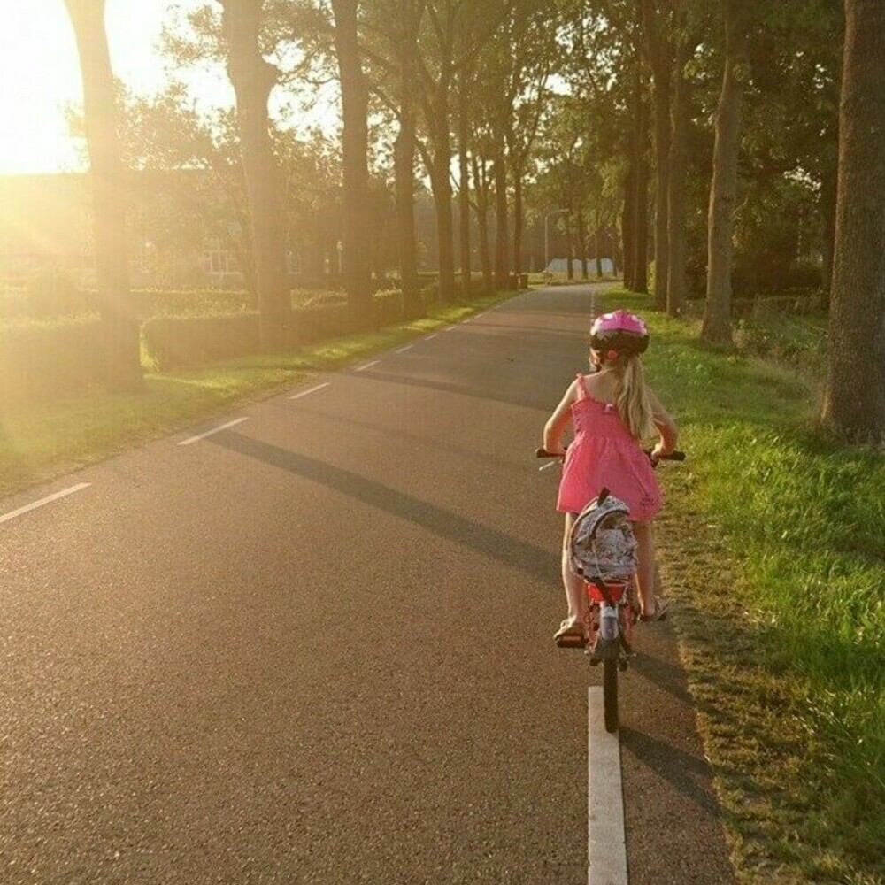 Girl biking at sunset